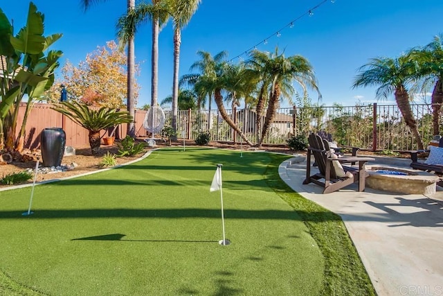 view of community with a patio area and a fire pit