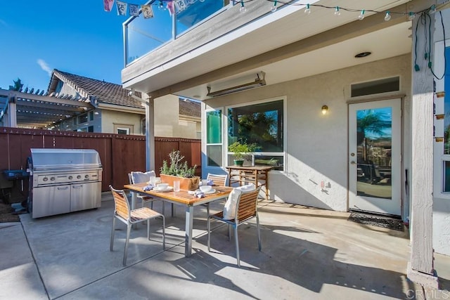 view of patio / terrace featuring grilling area and a pergola