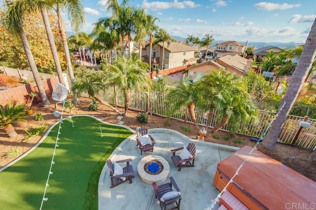 surrounding community featuring a fire pit, a patio, a jacuzzi, a fenced backyard, and a residential view