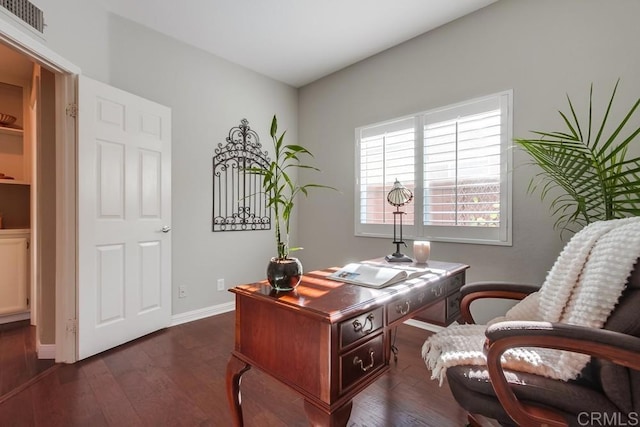 home office featuring visible vents, baseboards, and dark wood finished floors