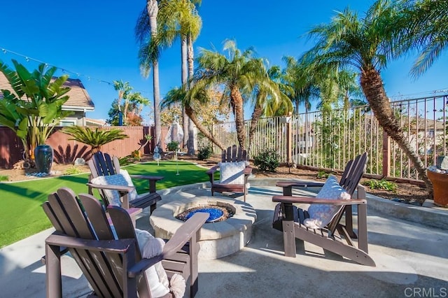 view of patio / terrace with an outdoor fire pit and a fenced backyard