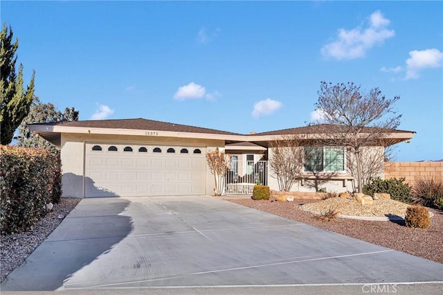 single story home featuring a garage