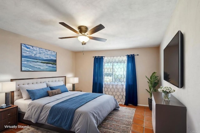 bedroom featuring ceiling fan and tile patterned floors