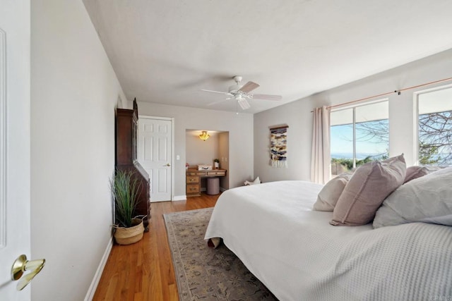 bedroom featuring light wood-type flooring and ceiling fan