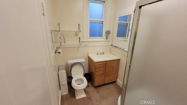 bathroom featuring toilet and vanity