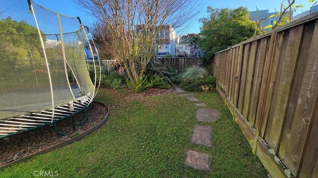 view of yard featuring a trampoline