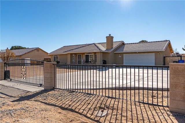 ranch-style house featuring a garage