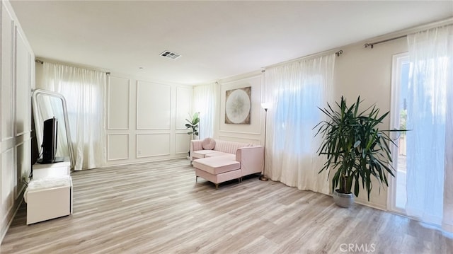 sitting room with light wood-type flooring