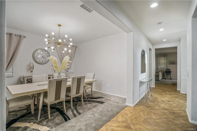 dining space featuring light carpet and a notable chandelier