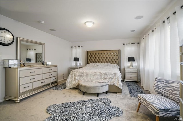 bedroom featuring light carpet