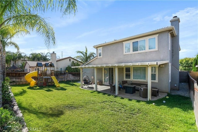 back of house with a playground, a lawn, an outdoor hangout area, and a patio