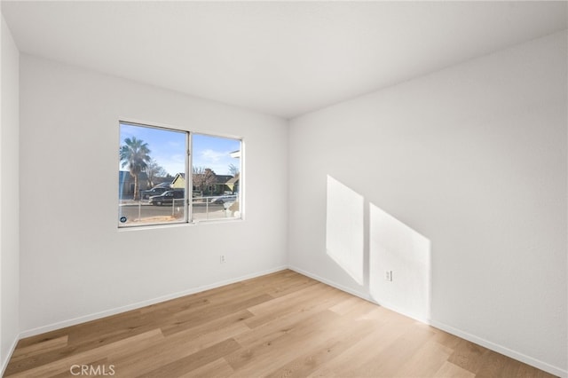 unfurnished room with light hardwood / wood-style flooring