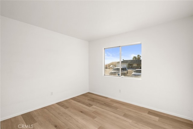 unfurnished room featuring light hardwood / wood-style floors