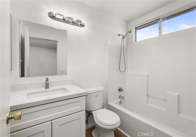 full bathroom featuring toilet, vanity, and shower / bathing tub combination