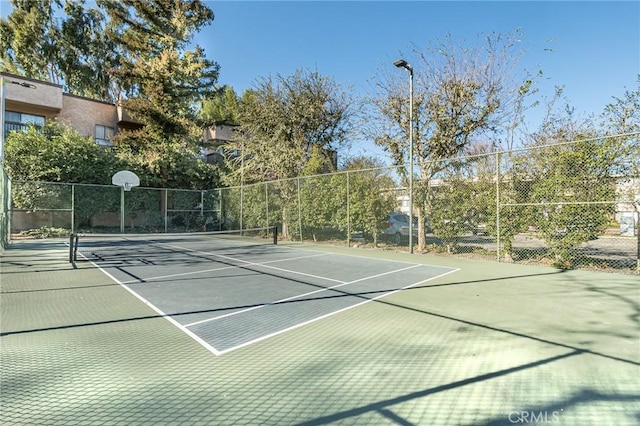 22100 Burbank Blvd Unit 138D, Woodland Hills, CA 91367 - view of tennis court featuring community basketball court