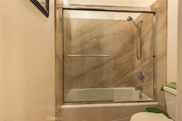 22100 Burbank Blvd Unit 138D, Woodland Hills, CA 91367 - full bath with toilet, combined bath / shower with glass door, and a textured wall