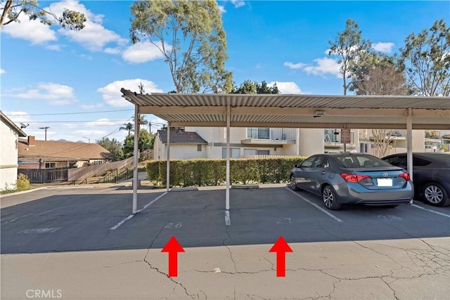 view of parking / parking lot with a carport