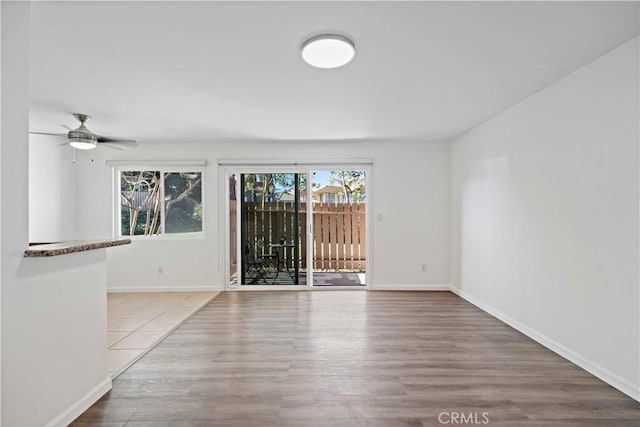 empty room featuring ceiling fan and wood-type flooring