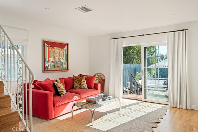 living room with light hardwood / wood-style floors