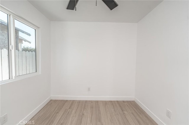 unfurnished room featuring ceiling fan and light hardwood / wood-style floors