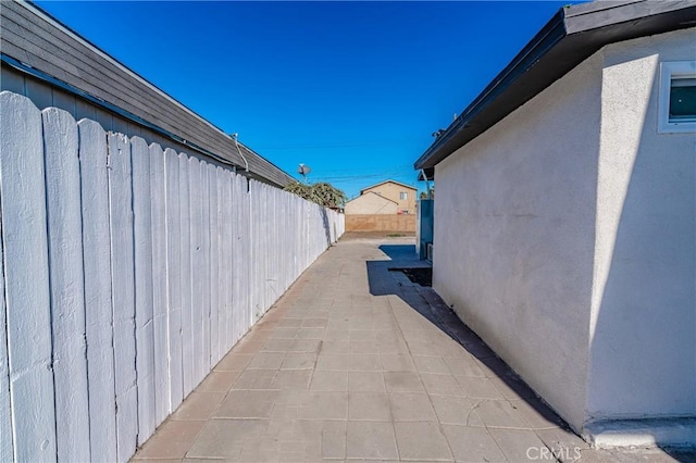 view of side of property featuring a patio