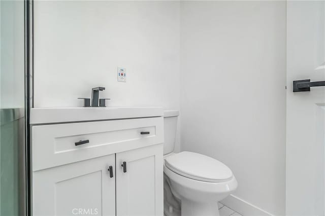 bathroom featuring toilet and vanity