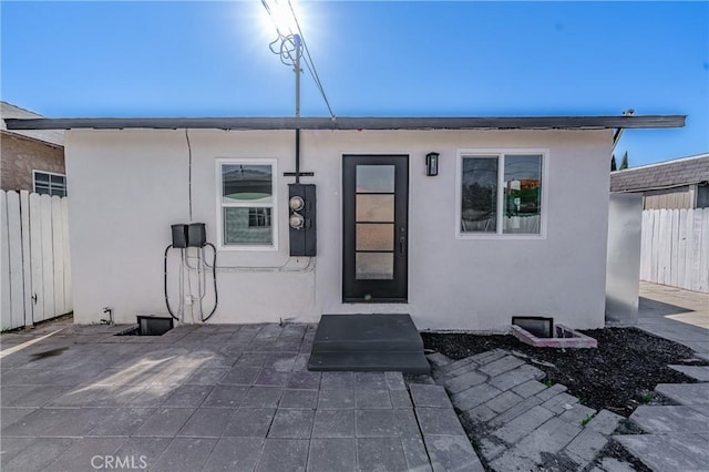 doorway to property with a patio