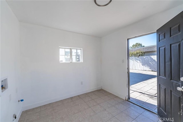 spare room with light tile patterned floors