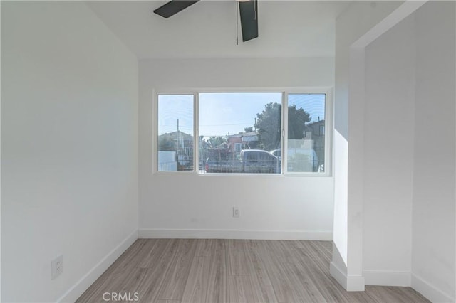 spare room with light hardwood / wood-style floors and ceiling fan