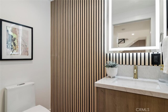 bathroom with toilet and vanity