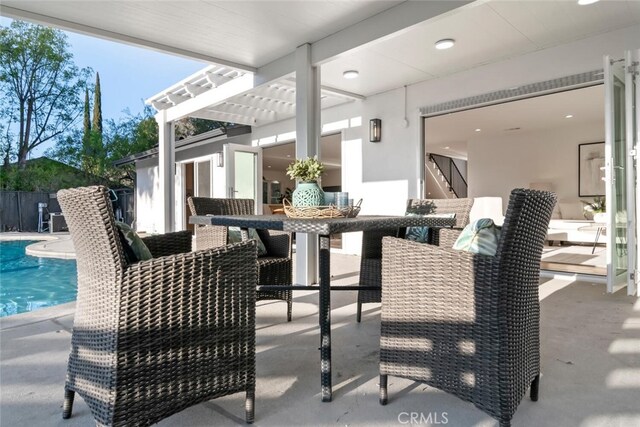 view of patio with a fenced in pool