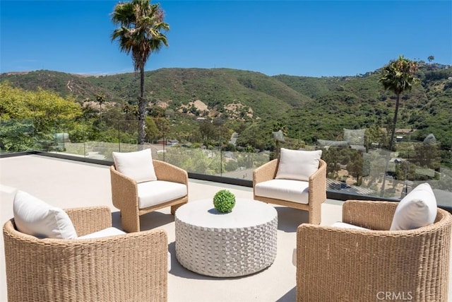 view of patio / terrace with a mountain view