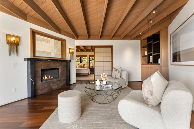 living room with wood ceiling, dark hardwood / wood-style flooring, french doors, a premium fireplace, and lofted ceiling with beams