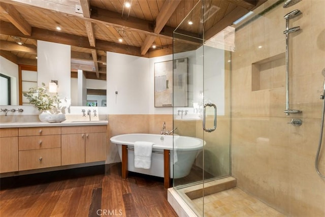 bathroom with hardwood / wood-style floors, vanity, beamed ceiling, shower with separate bathtub, and wooden ceiling