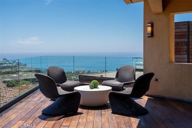 wooden deck with a water view