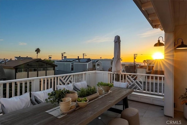 view of balcony at dusk