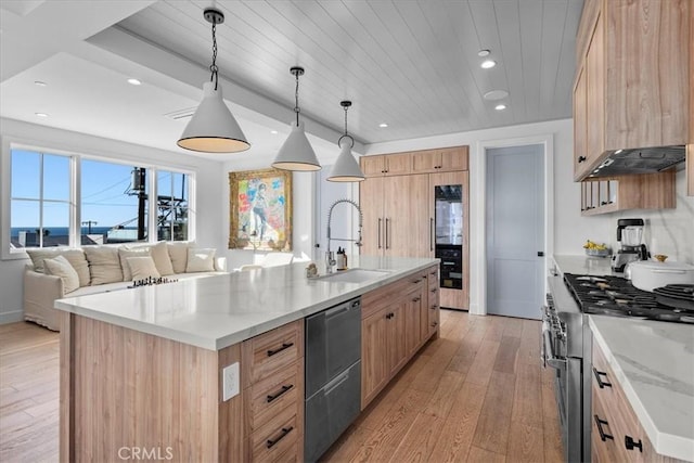 kitchen featuring pendant lighting, sink, wood ceiling, an island with sink, and stainless steel appliances