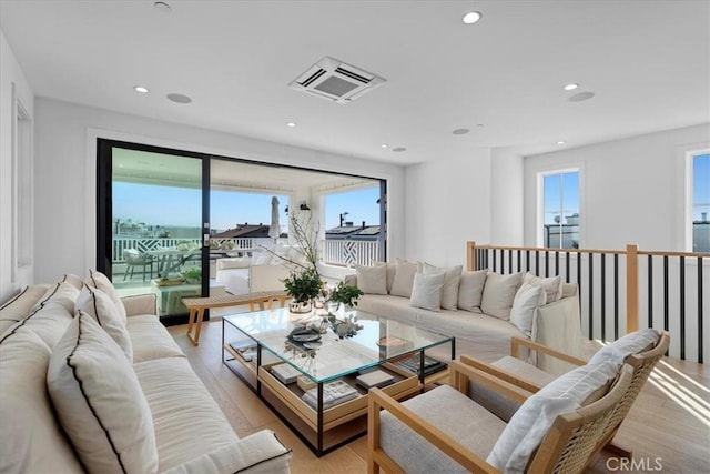 living room with light hardwood / wood-style flooring