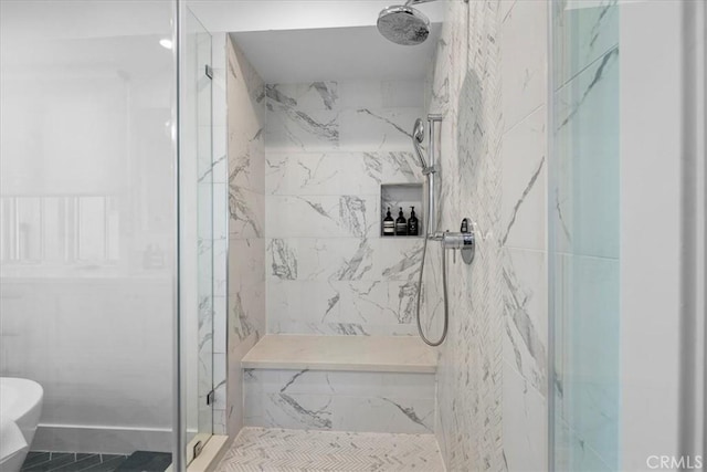 bathroom with a tile shower