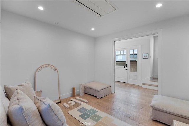 living room with light hardwood / wood-style flooring