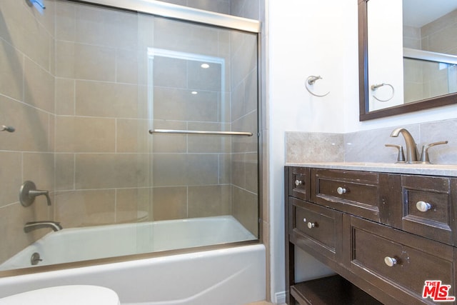 full bathroom with toilet, backsplash, vanity, and shower / bathing tub combination