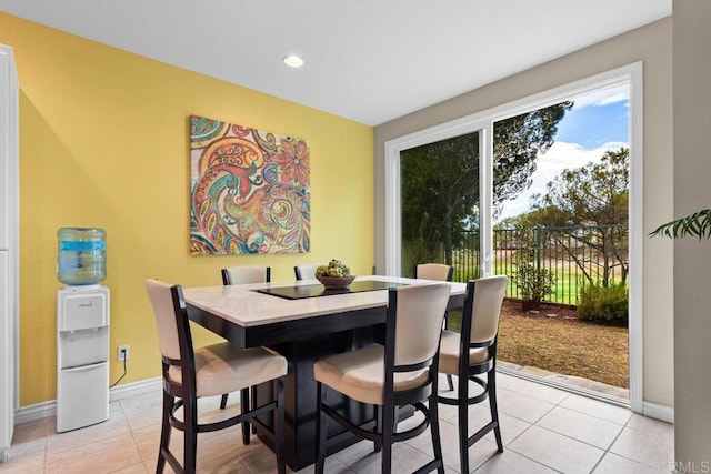 dining space with light tile patterned floors