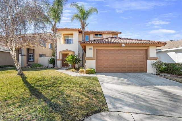 mediterranean / spanish-style house featuring a front lawn and a garage