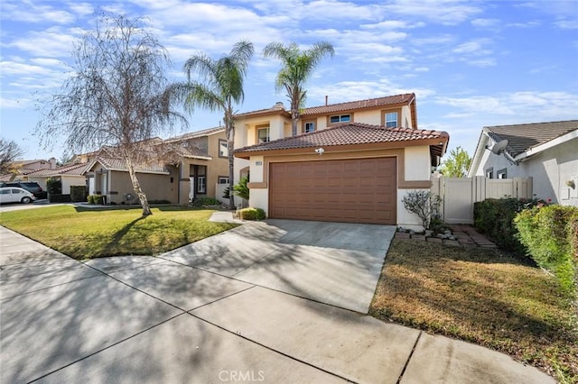 mediterranean / spanish-style house with a garage and a front yard