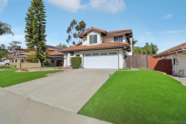 mediterranean / spanish-style home with a front yard and a garage