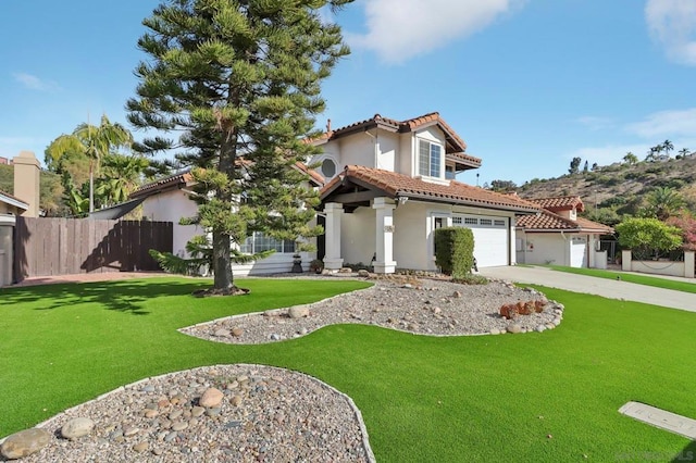 mediterranean / spanish-style home with a front yard