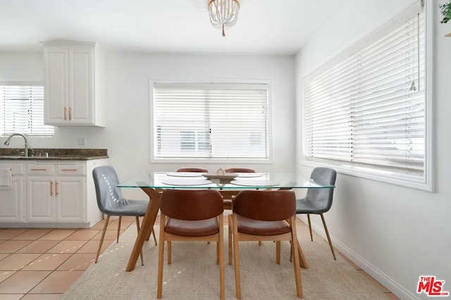 tiled dining room with sink