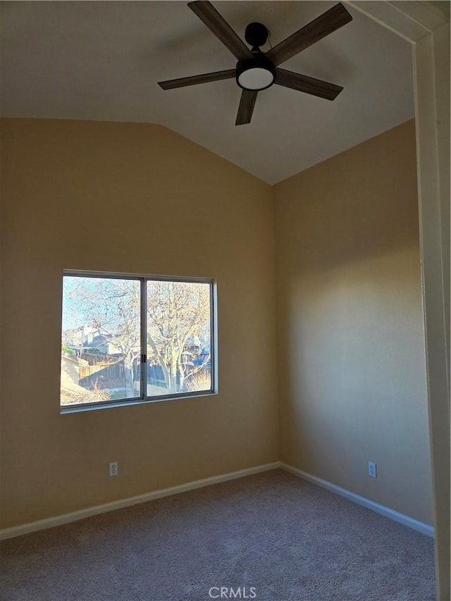 unfurnished room with ceiling fan, lofted ceiling, and carpet floors