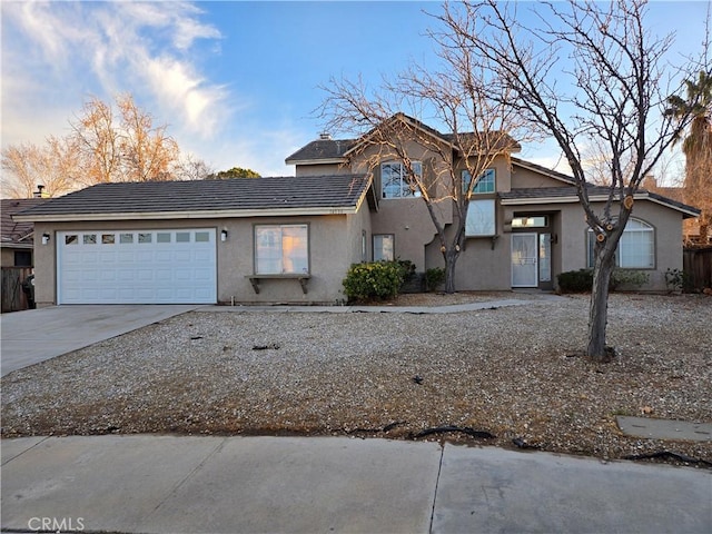 front of property with a garage