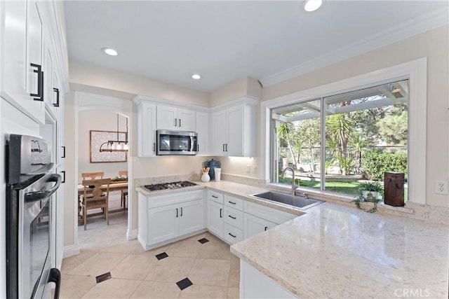 kitchen featuring sink, white cabinetry, stainless steel appliances, light tile patterned floors, and light stone counters